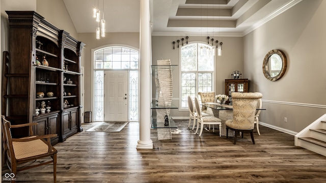 295 Watershed Ct, Noblesville, IN 46062 - foyer entrance featuring healthy amount of natural light, dark wood-style flooring, ornamental molding, a towering ceiling, and decorative columns