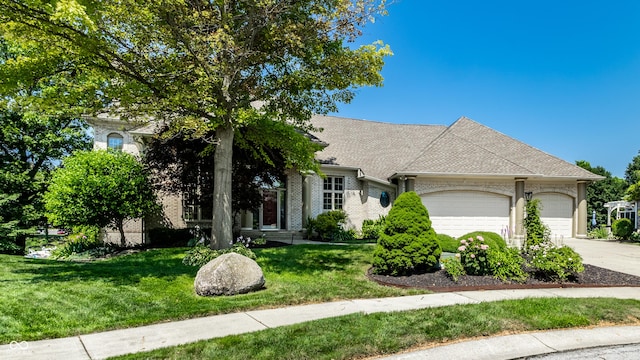 295 Watershed Ct, Noblesville, IN 46062 - view of front of home with a garage, driveway, a front yard, and brick siding