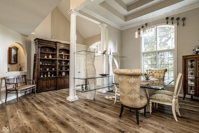 295 Watershed Ct, Noblesville, IN 46062 - dining area with wood finished floors, ornate columns, high vaulted ceiling, and ornamental molding