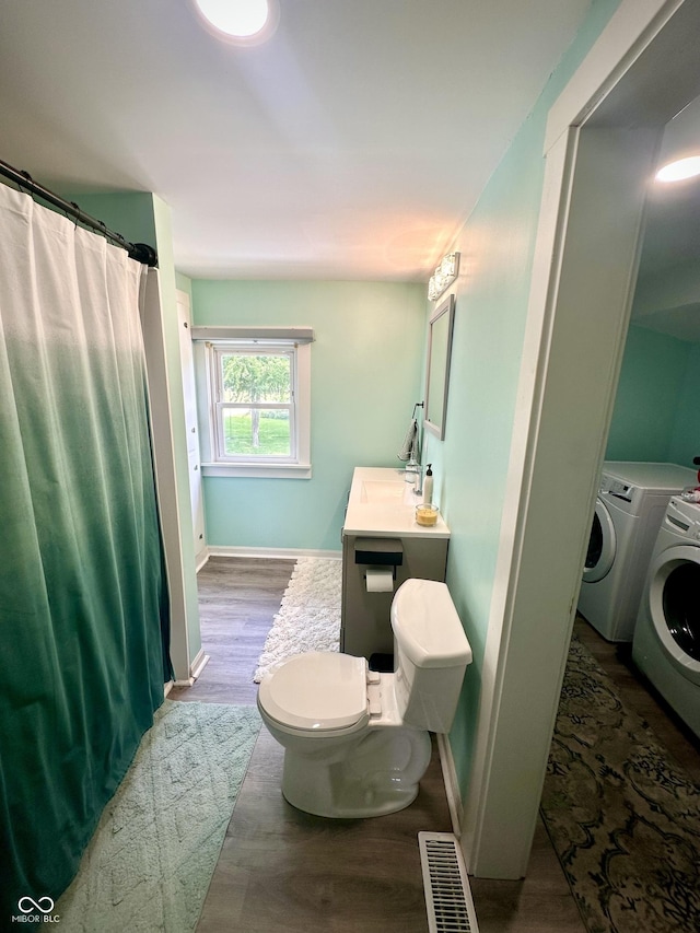 514 E 2nd St, Sheridan, IN 46069 - full bathroom with washer and clothes dryer, wood finished floors, vanity, and a shower with curtain