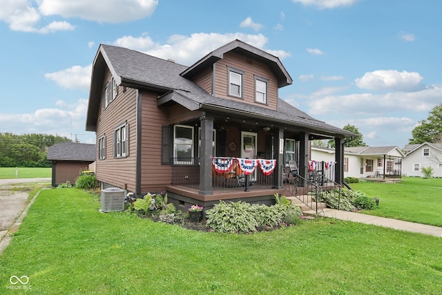 514 E 2nd St, Sheridan, IN 46069 - view of front of property with a porch, a front lawn, and a shingled roof