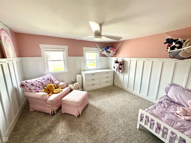 514 E 2nd St, Sheridan, IN 46069 - sitting room featuring light carpet, a wainscoted wall, ceiling fan, and a decorative wall