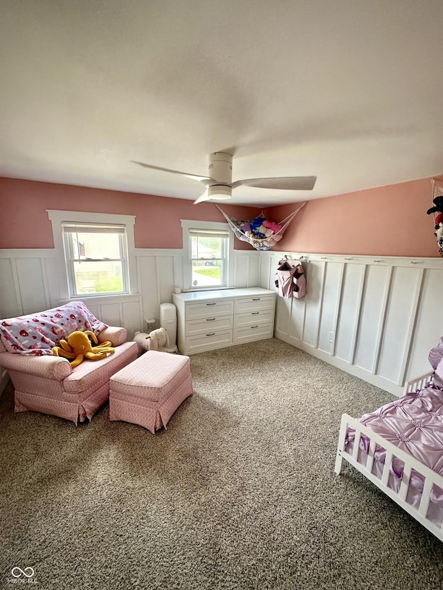 514 E 2nd St, Sheridan, IN 46069 - bedroom with light carpet, a decorative wall, wainscoting, and ceiling fan