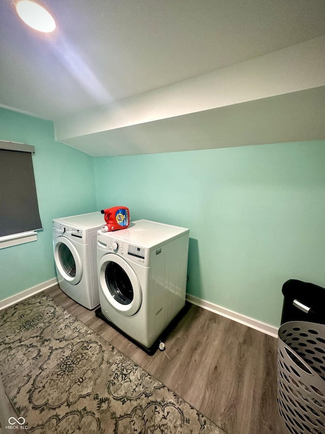514 E 2nd St, Sheridan, IN 46069 - laundry room with washing machine and dryer and light wood-type flooring