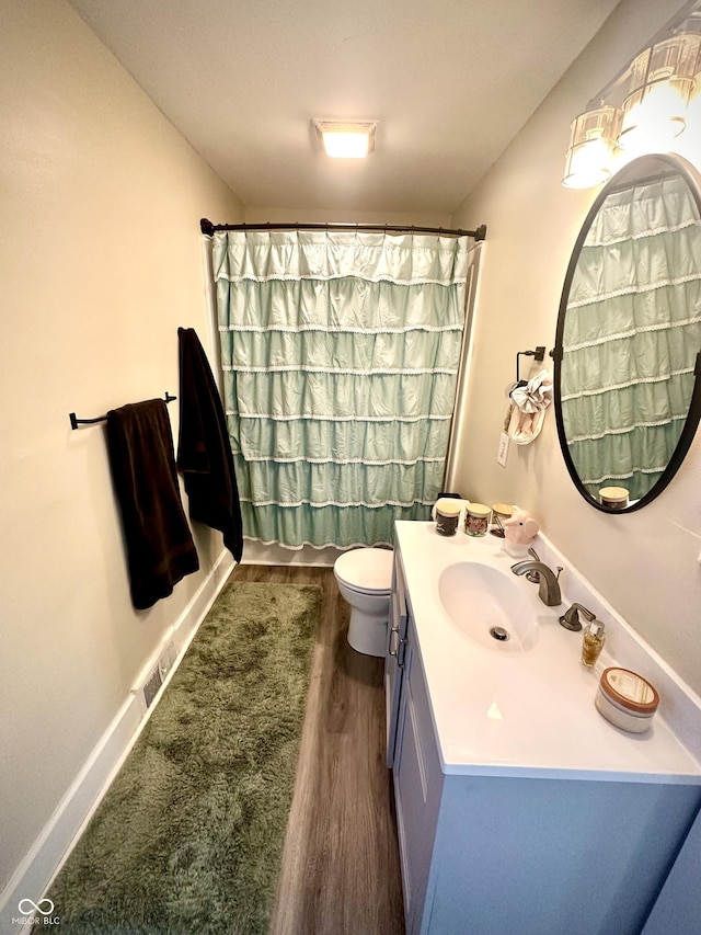 514 E 2nd St, Sheridan, IN 46069 - full bathroom featuring vanity, wood finished floors, and a shower with shower curtain