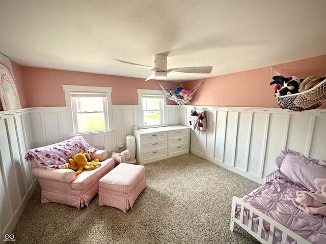 514 E 2nd St, Sheridan, IN 46069 - bedroom featuring wainscoting, light colored carpet, a decorative wall, and a ceiling fan