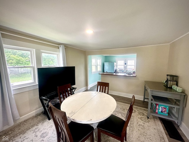 514 E 2nd St, Sheridan, IN 46069 - dining area featuring baseboards and wood finished floors