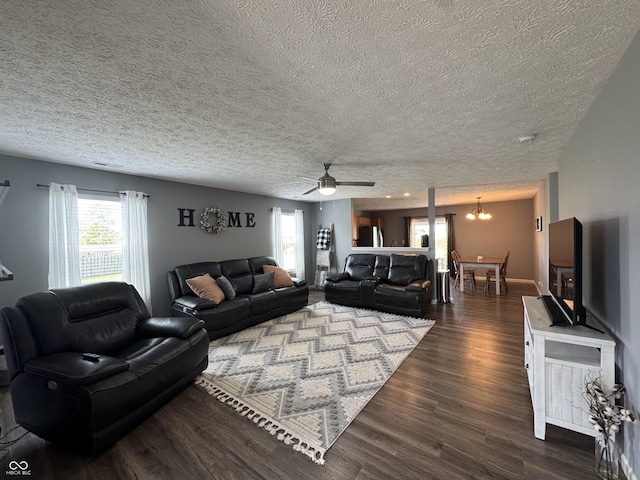 1406 Bigleaf Cir, Sheridan, IN 46069 - living area with a textured ceiling, a chandelier, dark wood finished floors, and ceiling fan