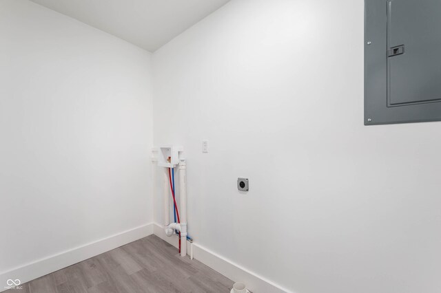 640 N 27th St, New Castle, IN 47362 - laundry area with electric panel, light wood-type flooring, hookup for a washing machine, and hookup for an electric dryer