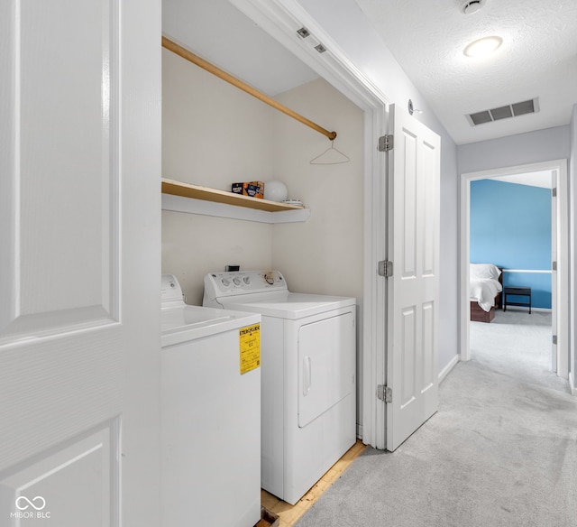 8642 Ray Cir, Indianapolis, IN 46256 - washroom with separate washer and dryer and a textured ceiling