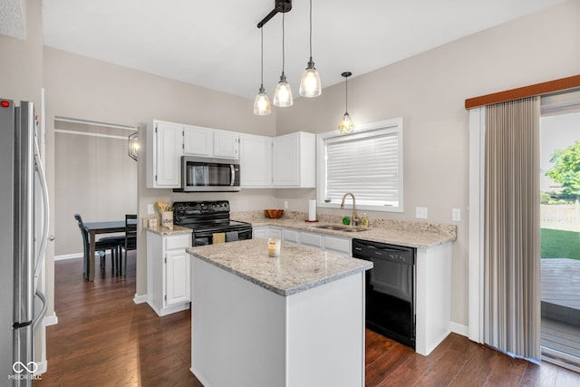 8642 Ray Cir, Indianapolis, IN 46256 - kitchen featuring black appliances, dark wood-style flooring, a kitchen island, white cabinetry, and light stone countertops