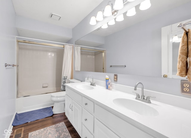 8642 Ray Cir, Indianapolis, IN 46256 - full bathroom featuring double vanity, shower / bath combination with curtain, and wood finished floors