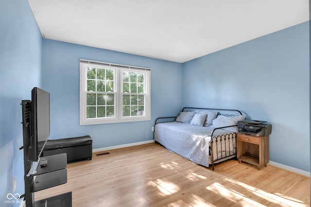 8642 Ray Cir, Indianapolis, IN 46256 - bedroom featuring wood finished floors and baseboards