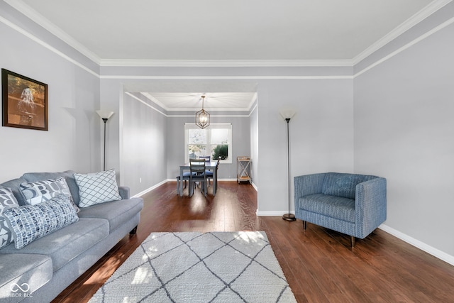 8642 Ray Cir, Indianapolis, IN 46256 - living area featuring wood finished floors, crown molding, and a chandelier