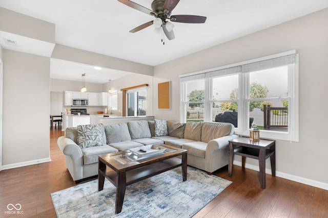 8642 Ray Cir, Indianapolis, IN 46256 - living area with ceiling fan and wood finished floors