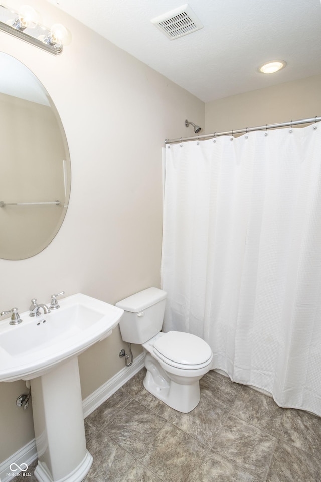 6448 W Whiteside Ct, Greenfield, IN 46140 - full bathroom with toilet and baseboards