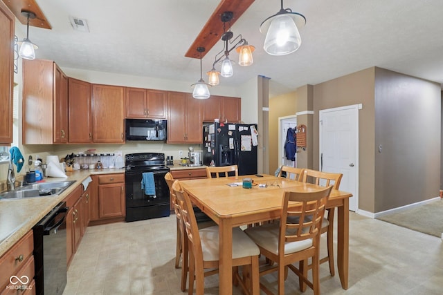 958 Denton Ct, Westfield, IN 46074 - kitchen featuring black appliances, light flooring, light countertops, and pendant lighting