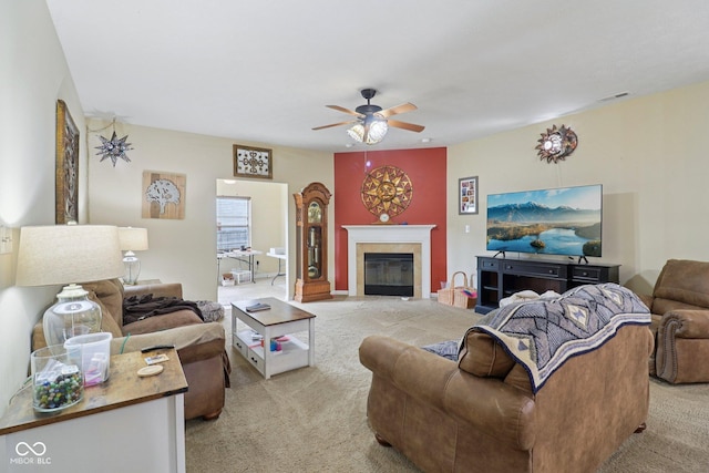 958 Denton Ct, Westfield, IN 46074 - living area with light colored carpet, ceiling fan, and a fireplace with flush hearth