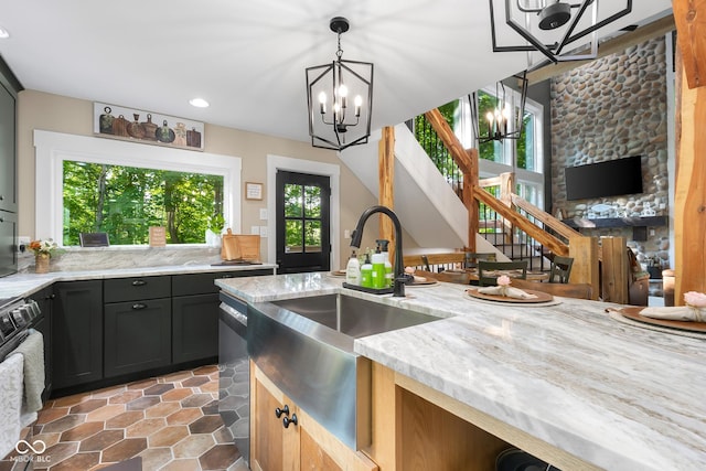 2350 E County Road 20 N, North Vernon, IN 47265 - kitchen with a chandelier, light stone counters, recessed lighting, pendant lighting, and gas range