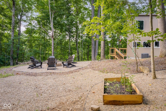 2350 E County Road 20 N, North Vernon, IN 47265 - view of yard with an outdoor fire pit, a vegetable garden, a patio area, and stairs