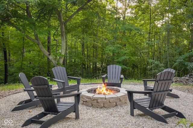 2350 E County Road 20 N, North Vernon, IN 47265 - view of patio / terrace featuring an outdoor fire pit and a view of trees