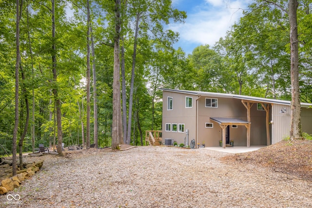 2350 E County Road 20 N, North Vernon, IN 47265 - back of property with gravel driveway and a patio area