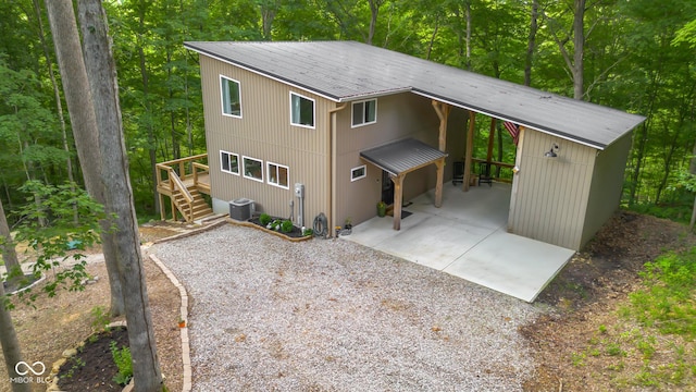 2350 E County Road 20 N, North Vernon, IN 47265 - view of front of home featuring a patio, stairway, driveway, and a wooden deck