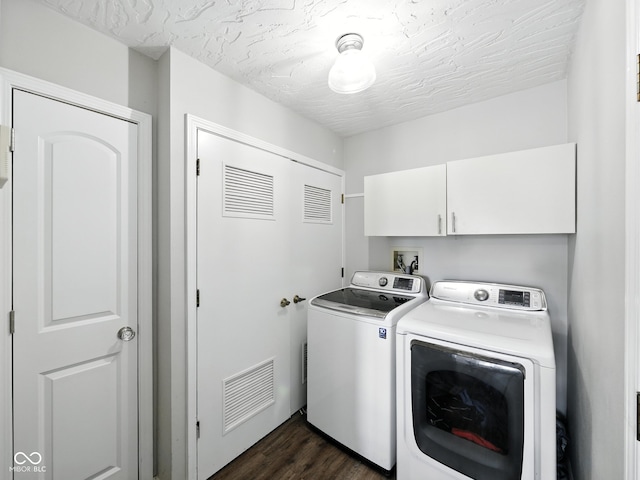 856 Cypress N, Greenwood, IN 46143 - washroom featuring cabinet space, washing machine and clothes dryer, and dark wood finished floors