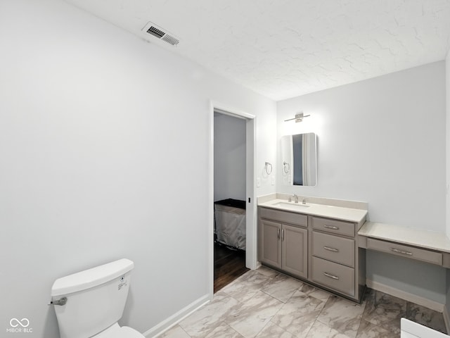 856 Cypress N, Greenwood, IN 46143 - bathroom with vanity, marble finish flooring, and a textured ceiling