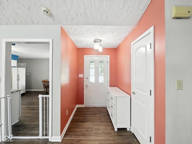 856 Cypress N, Greenwood, IN 46143 - entrance foyer featuring dark wood finished floors and a textured ceiling