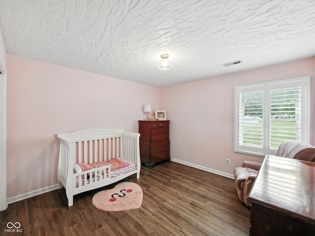 856 Cypress N, Greenwood, IN 46143 - bedroom featuring wood finished floors and a textured ceiling