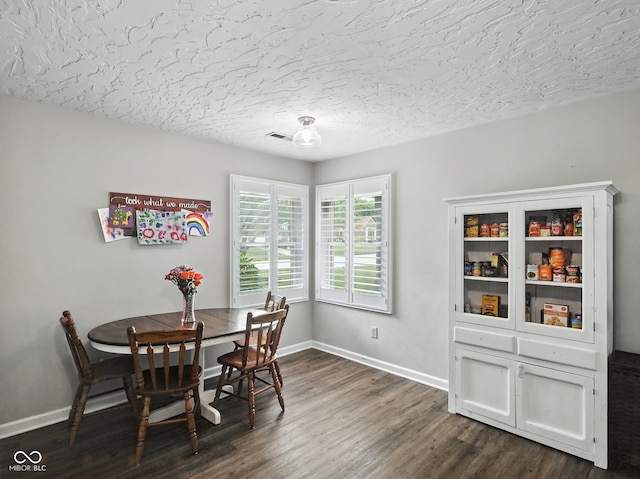 856 Cypress N, Greenwood, IN 46143 - dining room featuring dark wood-style floors and a textured ceiling
