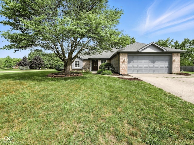856 Cypress N, Greenwood, IN 46143 - ranch-style home featuring a garage, concrete driveway, a front lawn, and brick siding