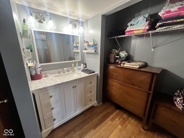 207 W Elm St, Spiceland, IN 47385 - bathroom with wood finished floors, vanity, and a shower