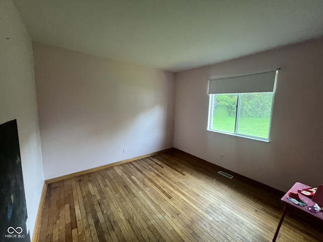 207 W Elm St, Spiceland, IN 47385 - empty room with wood-type flooring and baseboards