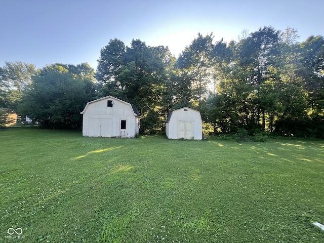 207 W Elm St, Spiceland, IN 47385 - view of green lawn featuring a storage shed and view of scattered trees