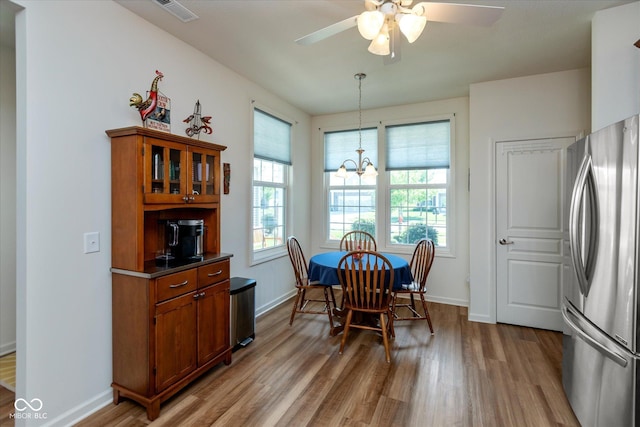 4905 Lilium Dr, Plainfield, IN 46168 - dining room featuring light wood-type flooring, a chandelier, and ceiling fan