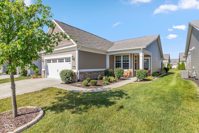 4905 Lilium Dr, Plainfield, IN 46168 - view of front of home with concrete driveway, a garage, a front yard, a shingled roof, and brick siding