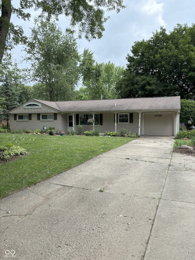 10155 Orchard Park Dr W, Carmel, IN 46280 - single story home featuring an attached garage, a front yard, and concrete driveway