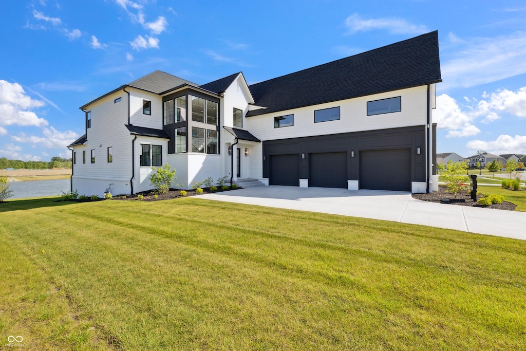 1414 Chatham Hills Blvd, Westfield, IN 46074 - view of front of property featuring a garage, driveway, and a front lawn