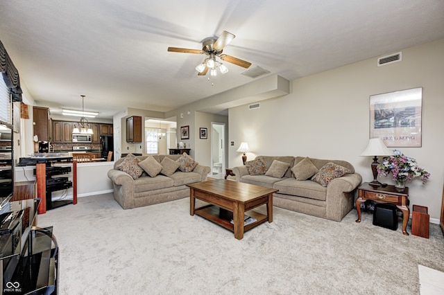 6813 Bluffgrove Dr, Indianapolis, IN 46278 - living room with ceiling fan and light colored carpet