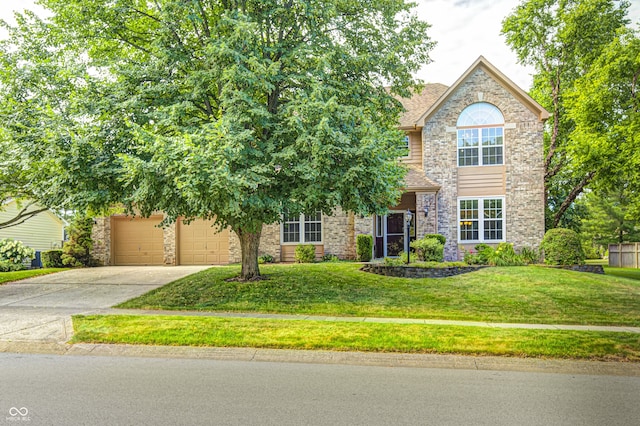 6813 Bluffgrove Dr, Indianapolis, IN 46278 - view of front of home featuring driveway, a front lawn, a garage, and stone siding