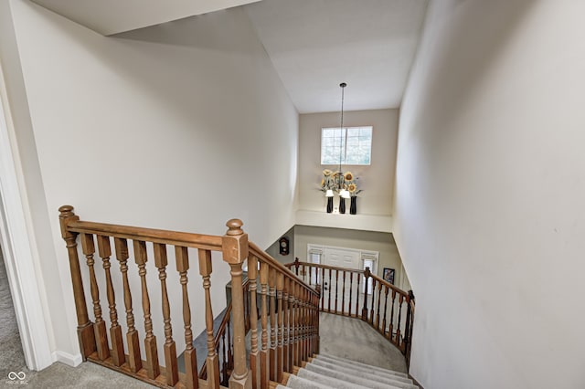 6813 Bluffgrove Dr, Indianapolis, IN 46278 - stairs with a chandelier and carpet
