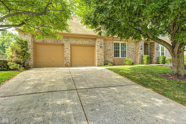 6813 Bluffgrove Dr, Indianapolis, IN 46278 - obstructed view of property featuring an attached garage, concrete driveway, brick siding, and a chimney