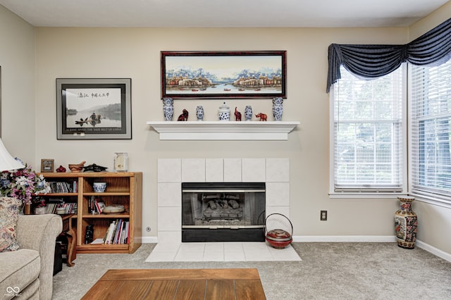 6813 Bluffgrove Dr, Indianapolis, IN 46278 - carpeted living room featuring a tile fireplace and baseboards