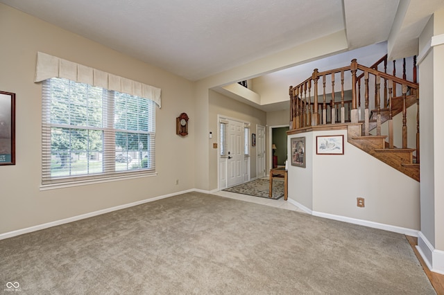 6813 Bluffgrove Dr, Indianapolis, IN 46278 - carpeted foyer with stairway and a raised ceiling