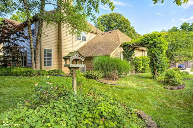 6813 Bluffgrove Dr, Indianapolis, IN 46278 - view of front facade featuring a front lawn and roof with shingles
