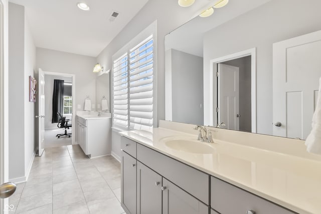 10795 Creekbed Cir, Fishers, IN 46038 - bathroom with two vanities and tile patterned flooring