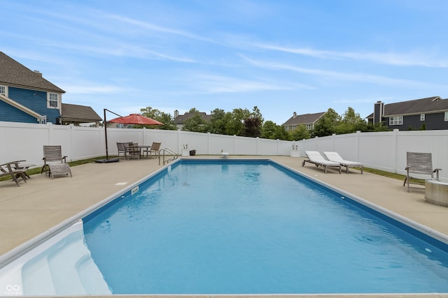 10795 Creekbed Cir, Fishers, IN 46038 - view of swimming pool with a patio area, a fenced backyard, and a residential view