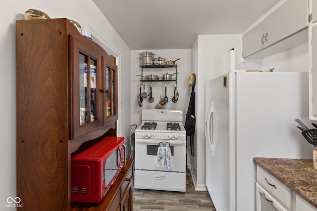 2017 E Legrande Ave, Indianapolis, IN 46203 - kitchen with white appliances and dark wood finished floors